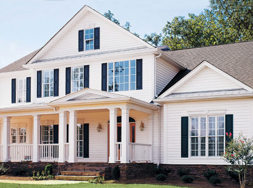 A beautiful traditional-style American home with white Preservation Siding.