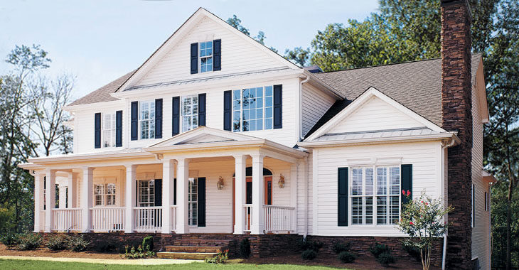 A beautiful traditional-style American home with white Preservation Siding.