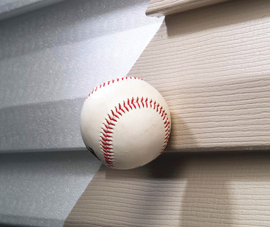 Image of ball hitting siding to show it's Impact Resistance