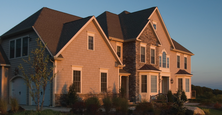 A beautiful suburban home shown at sunset