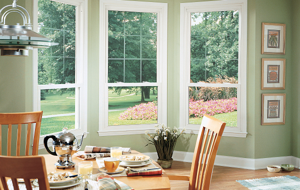 The dining area of a home with beautiful open windows