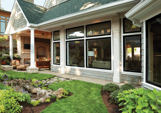 Home's exterior with many windows and soffit