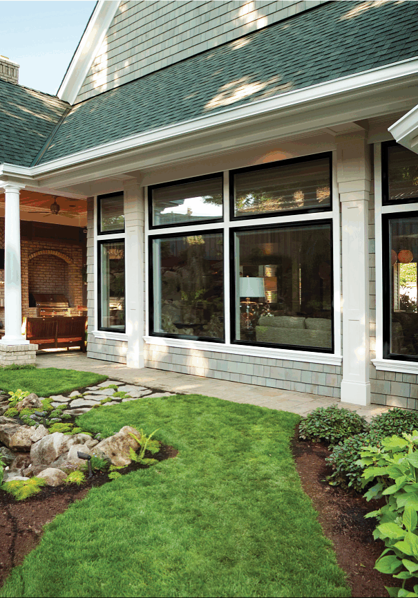 Home's exterior with many windows and soffit
